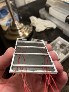 Hidden side of ceiling and light assembly.