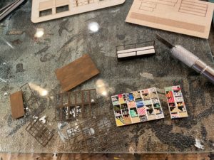 Painting and assembling display cases and counter.