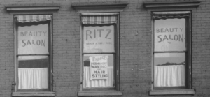 Close-up of salon windows on second floor.