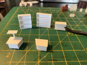 Made store fixtures from styrene sheet and strips.