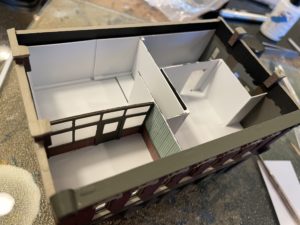 Frosted window wall installed in detective bureau.