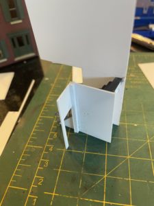 Non-modeled bathroom behind the stairs.