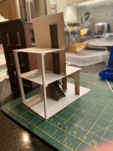 Upper floors in place and stairwell painted in place.