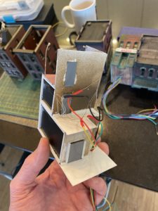 The wires come together behind the scenes.