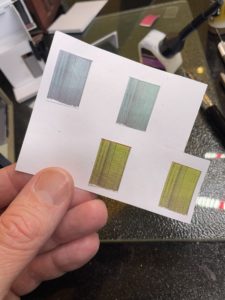 Curtains cut out and glued to back of wallpaper, to face outside the windows.