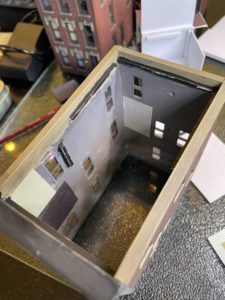 Wallpaper on rear wall can be seen at top of stairs.