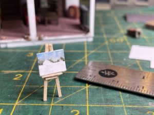 Easel with unfinished painting.