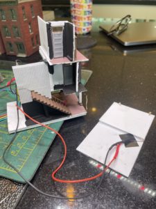 Two LEDs attached to roof illuminate third floor room.