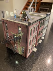 Building shown with two other townhouses.