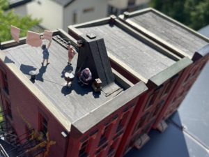 Three rooftops photographed outside.