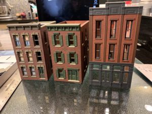 Three buildings in various stages of completion.